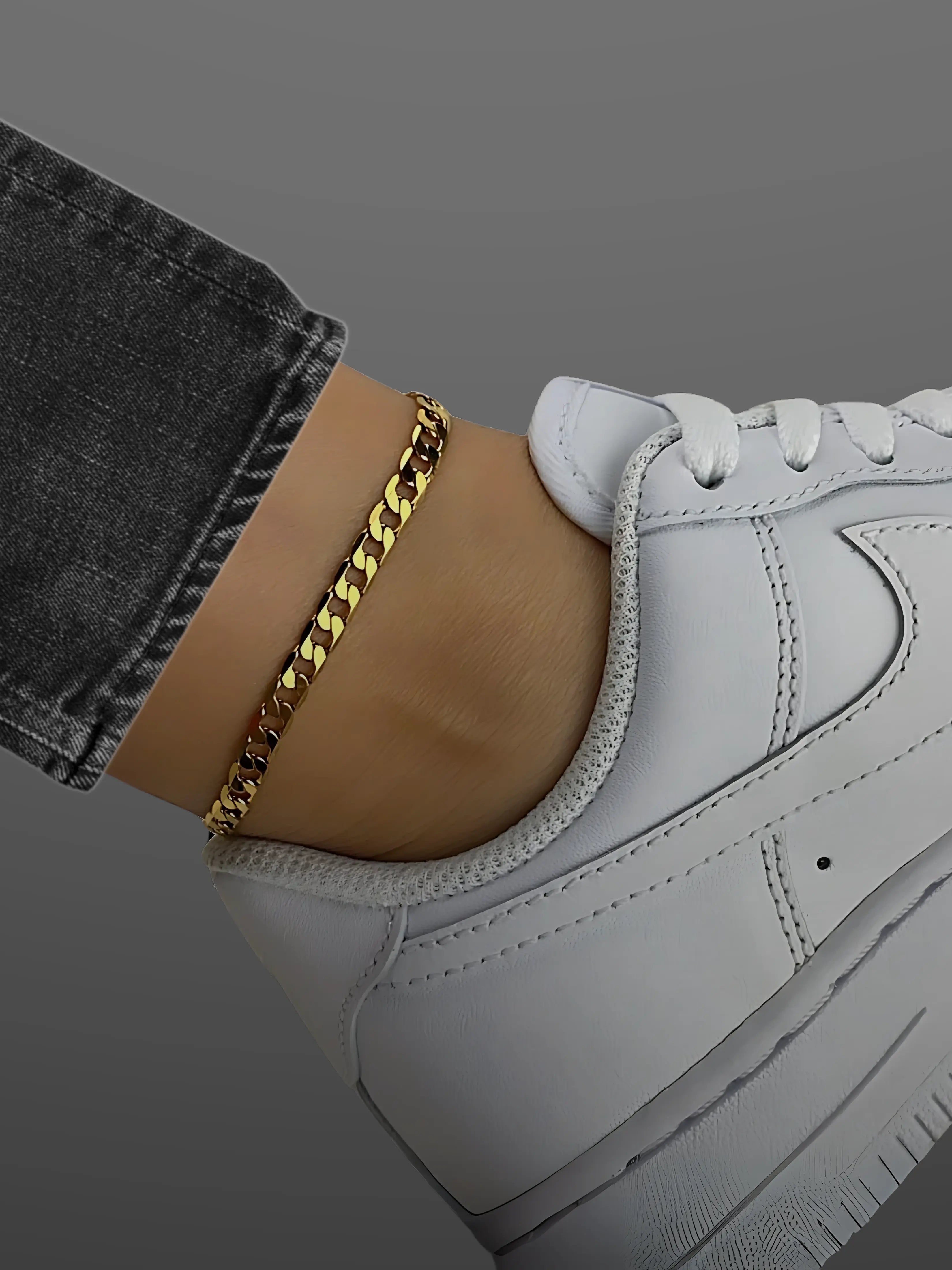 Stylish gold chain anklet on a woman's ankle paired with white sneakers, perfect for casual outfits. Anklets for Women.