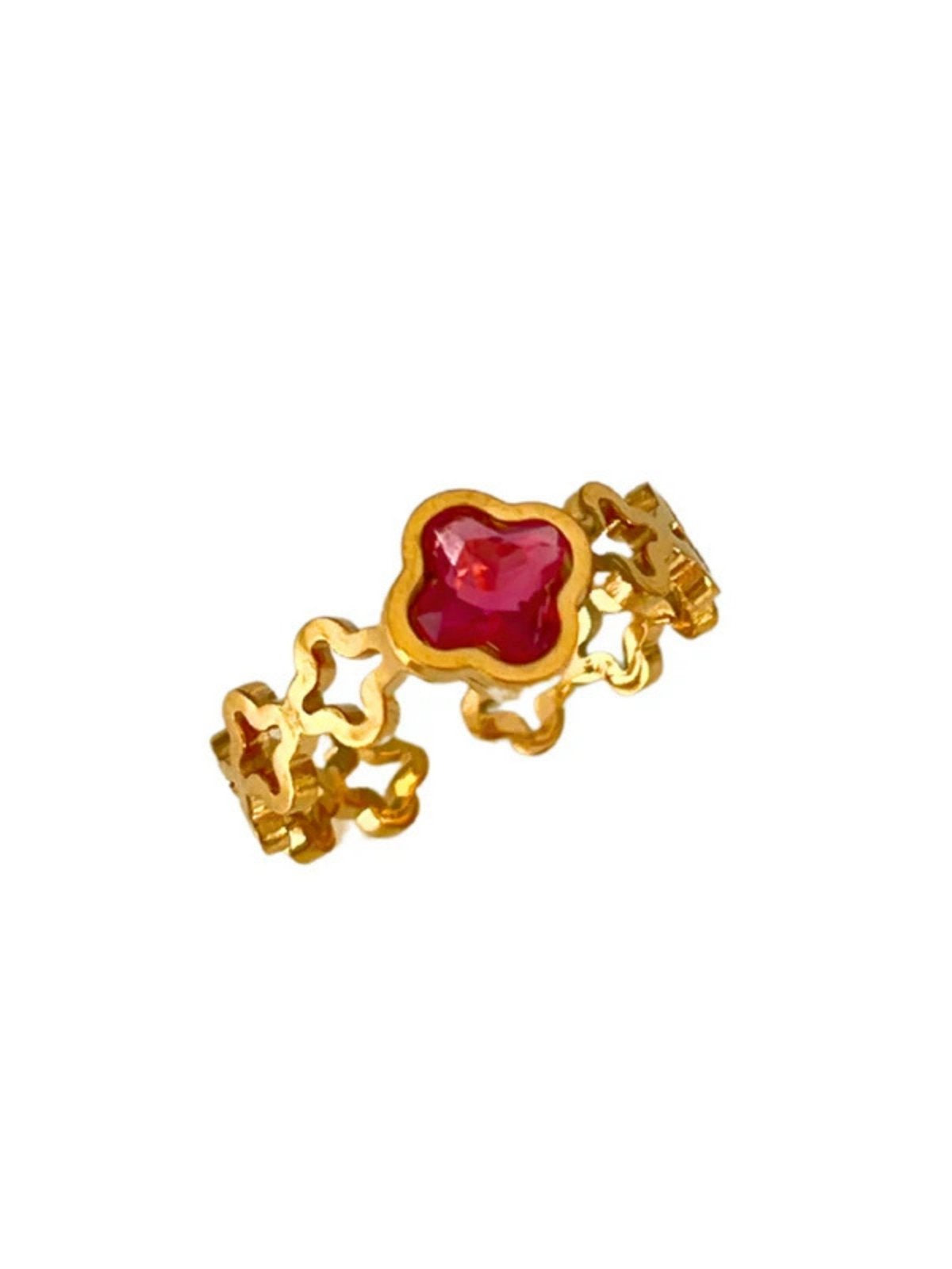 Amara Clover Ring | Shine With Me A gold-plated stainless steel ring with a red clover-shaped jewel in the center.