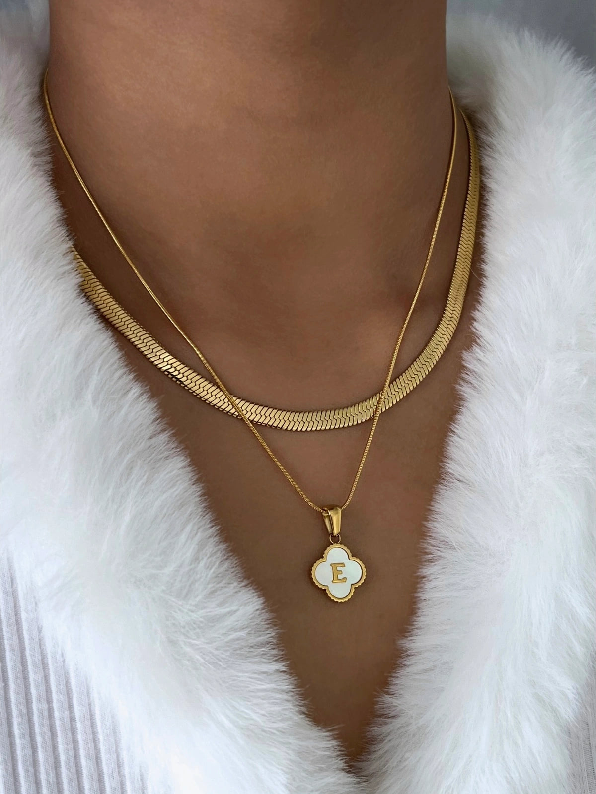 Clover Letter Necklace worn around neck — 18K gold‑plated stainless steel chain (45 cm +5 cm) with clover charm and letter by Shine With Me.