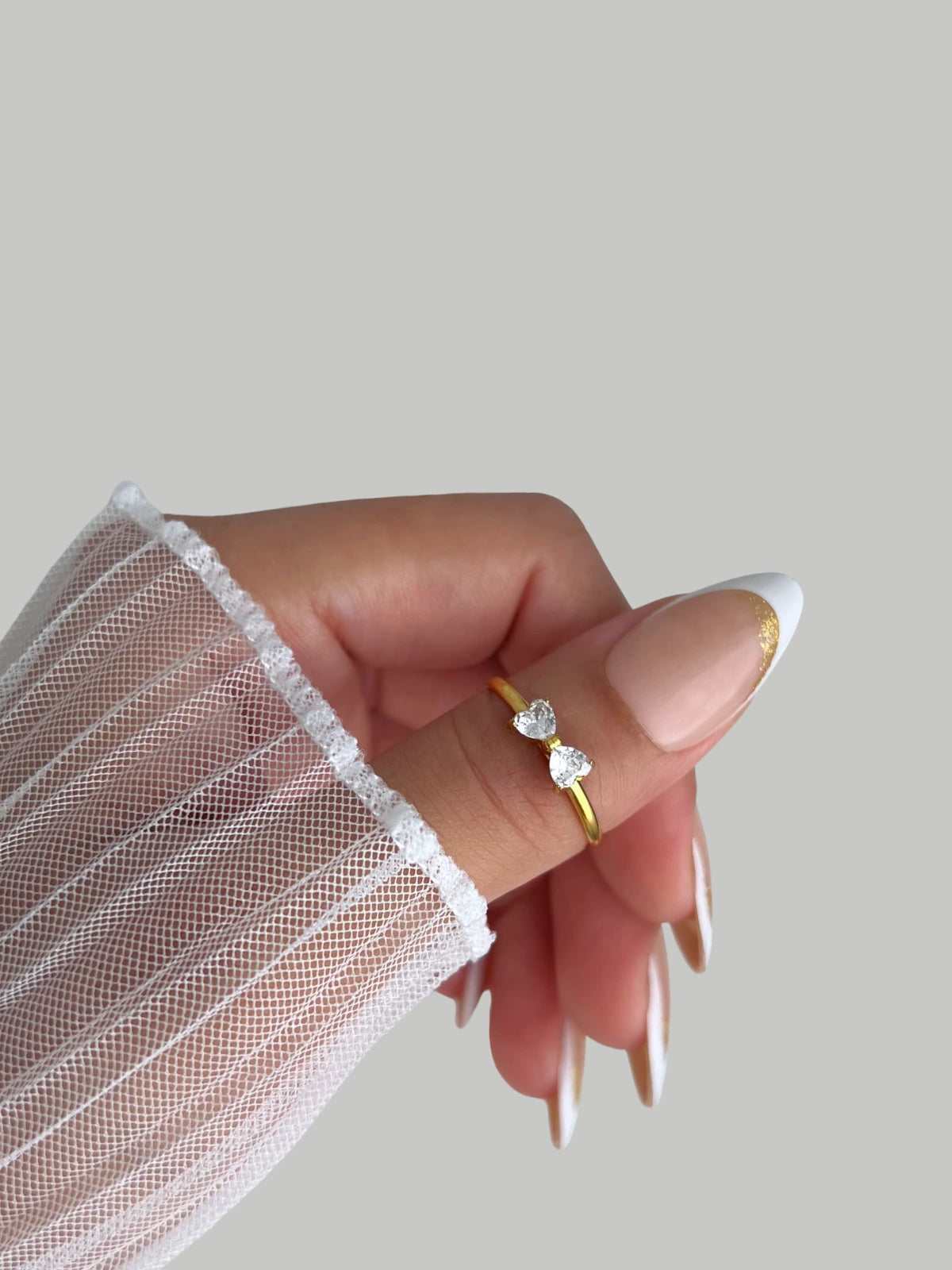 Dress Dial Ring-Hand wearing two rings with a blurred background