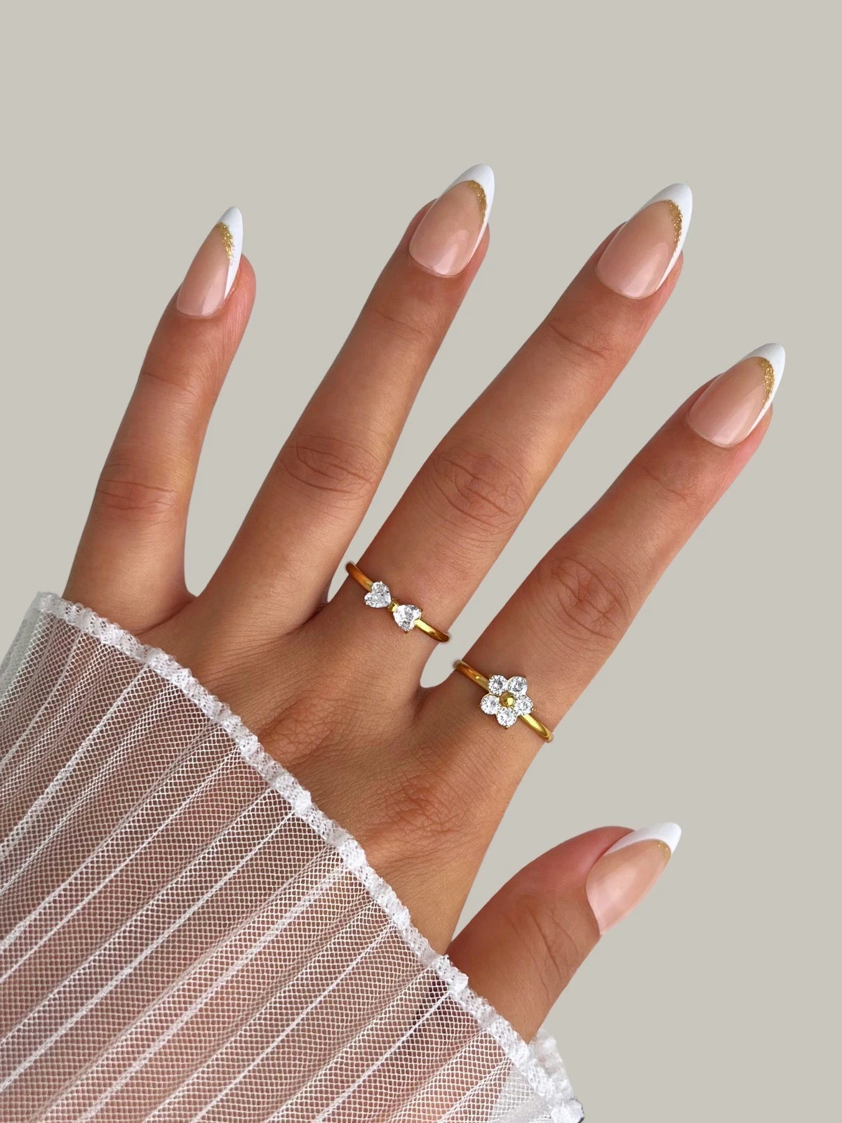 Dress Dial Ring – Worn on Finger-Hand wearing a gold ring with a diamond on a neutral background