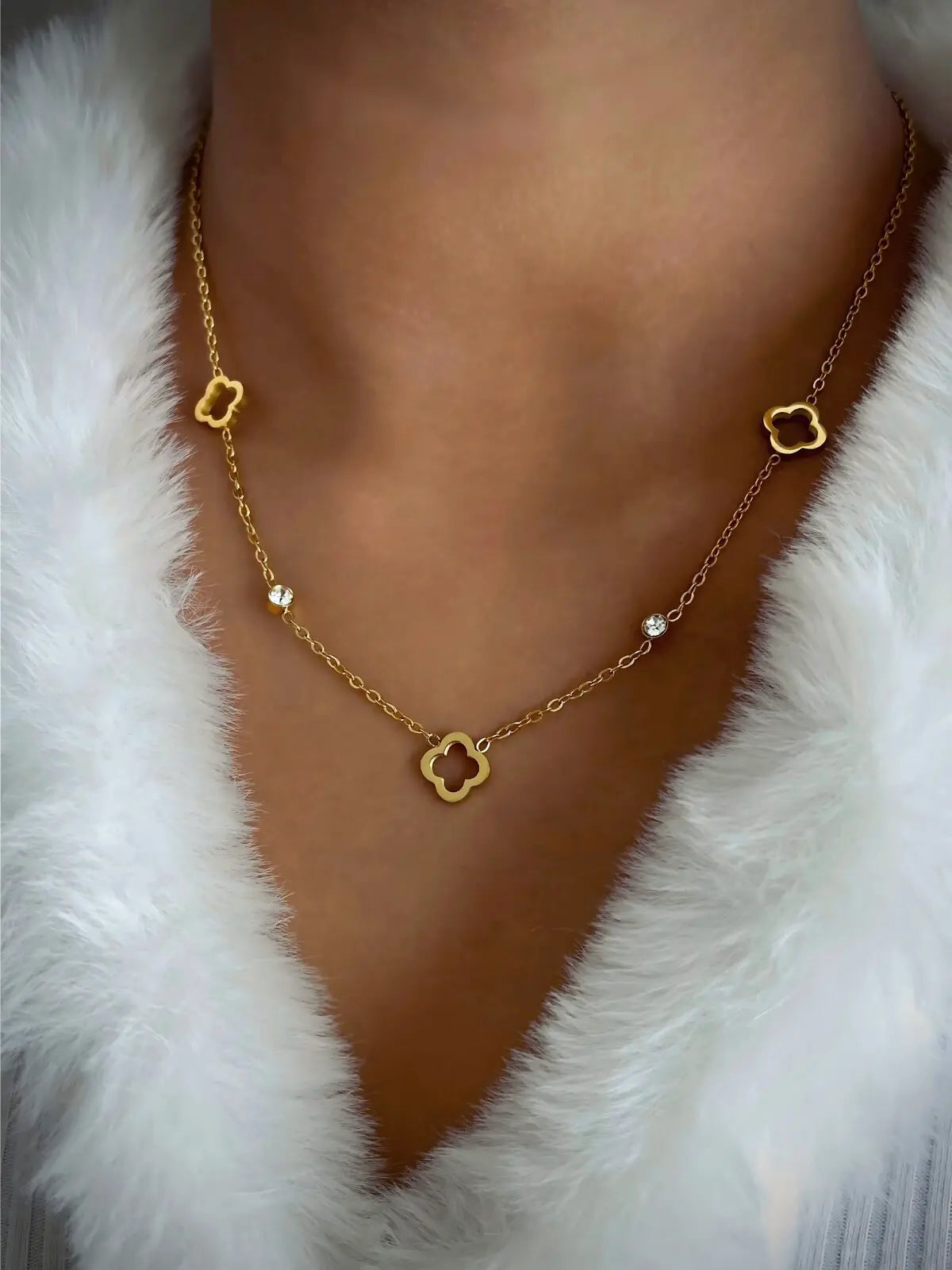 Dua Clover Necklace worn around neck — 18K gold-plated stainless steel & cubic zirconia by Shine With Me, chain 42 cm + 5 cm, styled look.