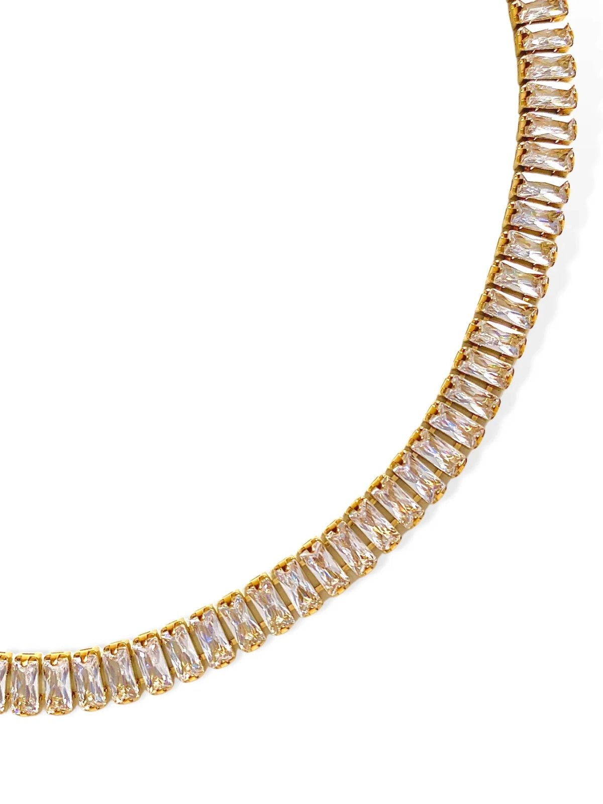 Elly Chain – Close‑Up Detail-Gold necklace with clear gemstones on a white background