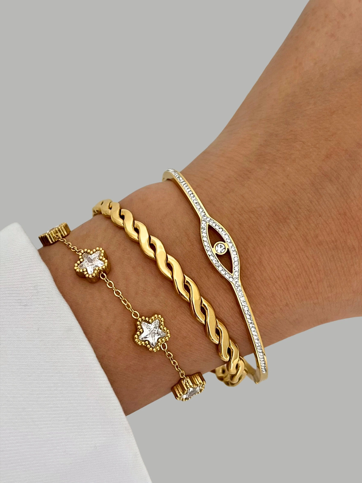 Eye of Grace BANGLE worn on wrist — 18K gold-plated stainless steel bangle (63 mm width) by Shine With Me, styled in Gold variant.