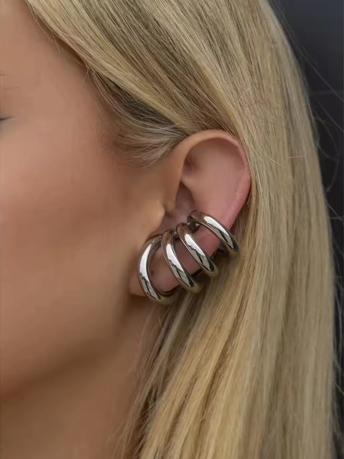 Faye Ear Cuff – Close‑Up Detail - Silver ear cuff worn by a person with blonde hair.