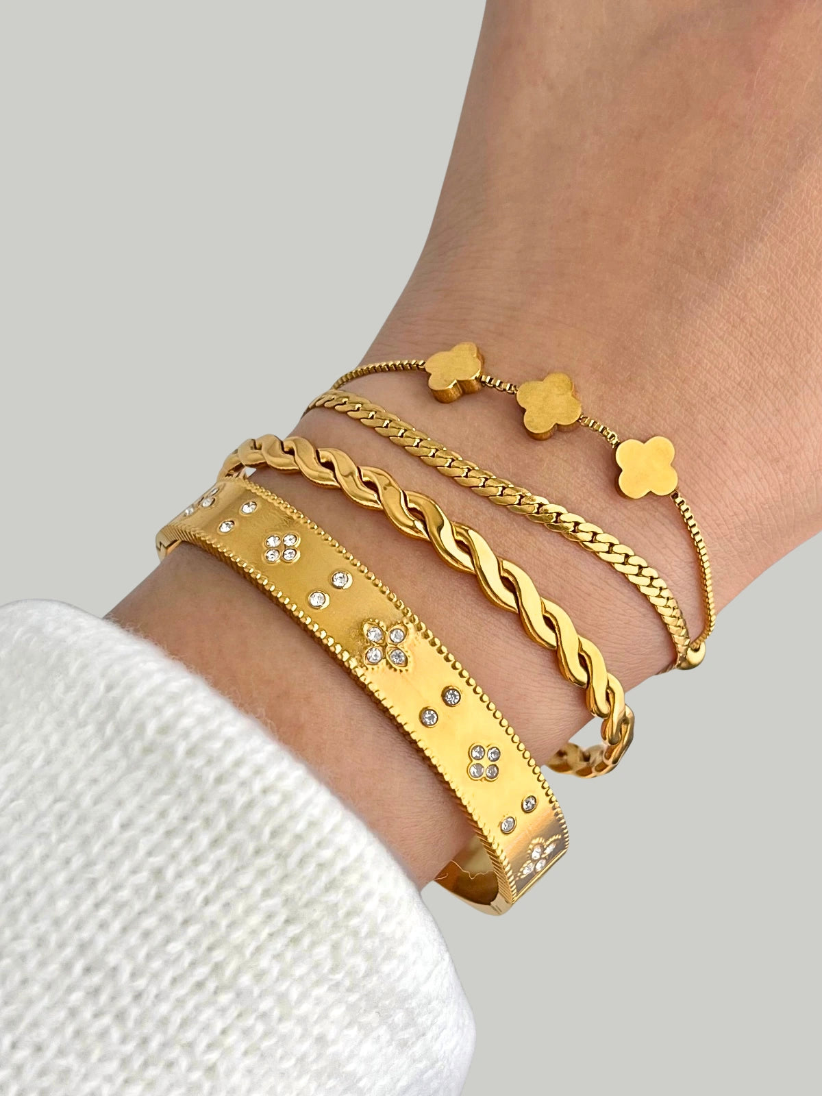 Golden Haze Bangle styled with other pieces by Shine With Me — gold-plated bracelet layering for modern chic and subtle shine.