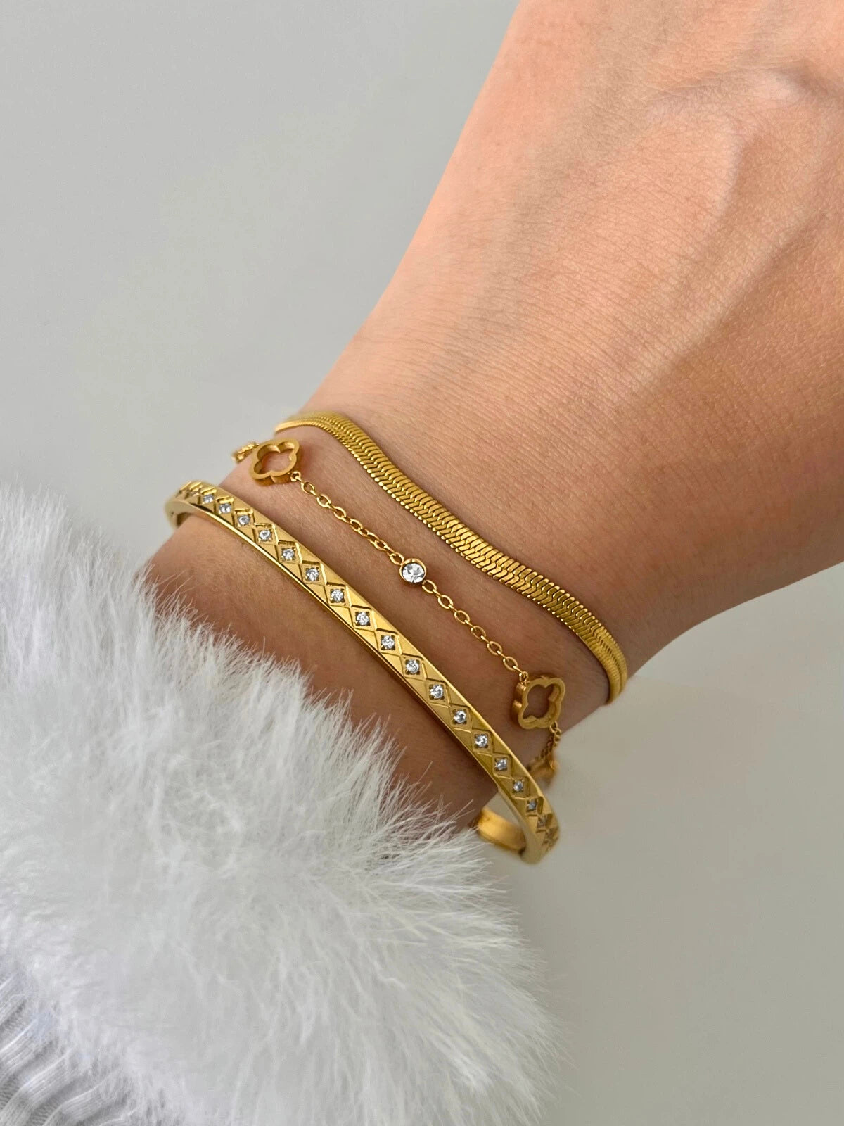 Close-up of Halo Clover Bracelet by Shine With Me, featuring polished gold plating and fine clover motif craftsmanship