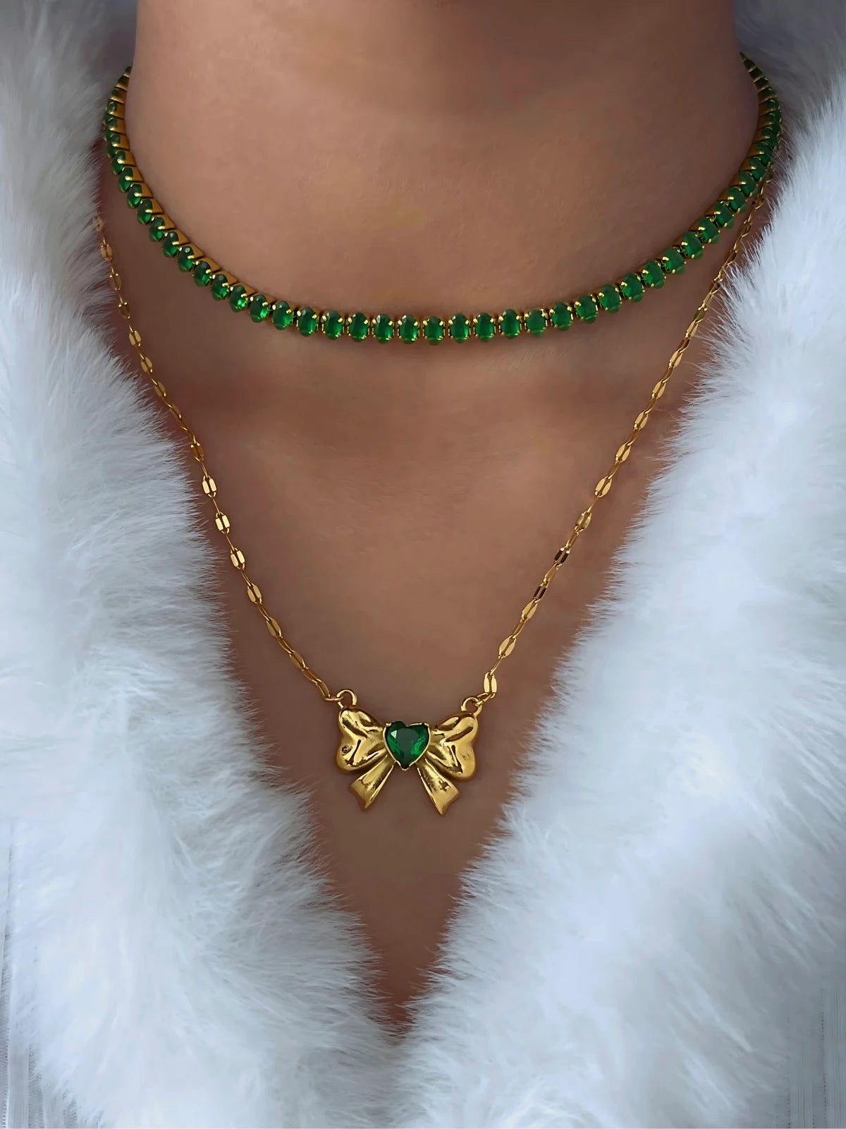 Heart & Bow Necklace worn around neck — 18K gold-plated stainless steel (chain 44 cm + 6 cm) by Shine With Me, styled look in Green variant.