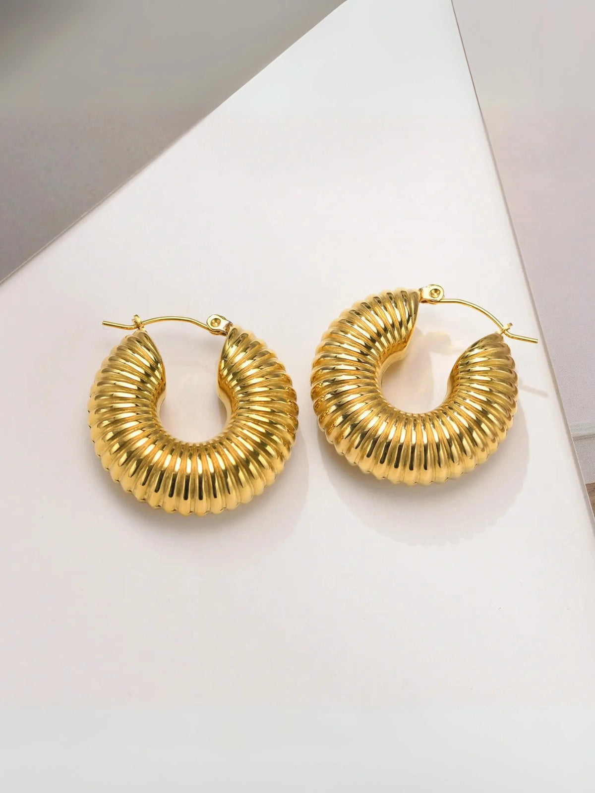 Close‑up of Karina Hoop Earring by Shine With Me showing gold‑plated finish, stainless steel base and fine craftsmanship (15.6 g weight).