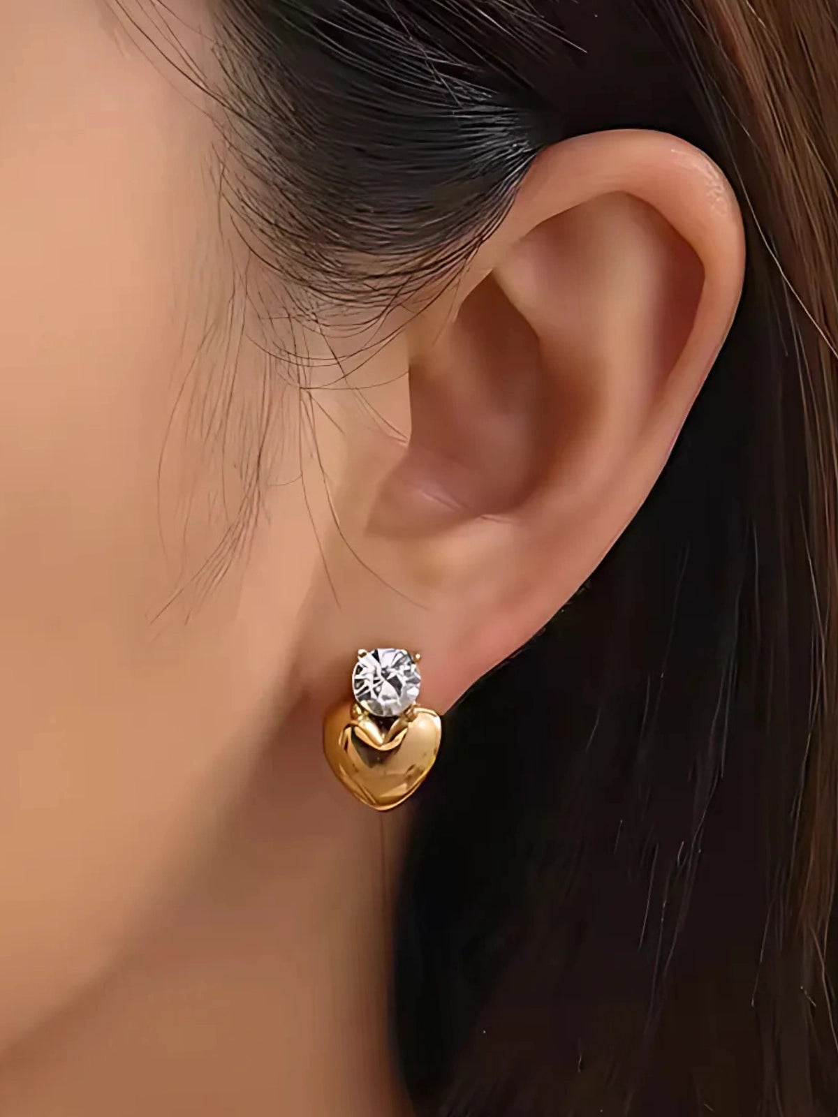Loma Studs Earring worn on ear — 18K gold‑plated stainless steel studs by Shine With Me, styled look.
