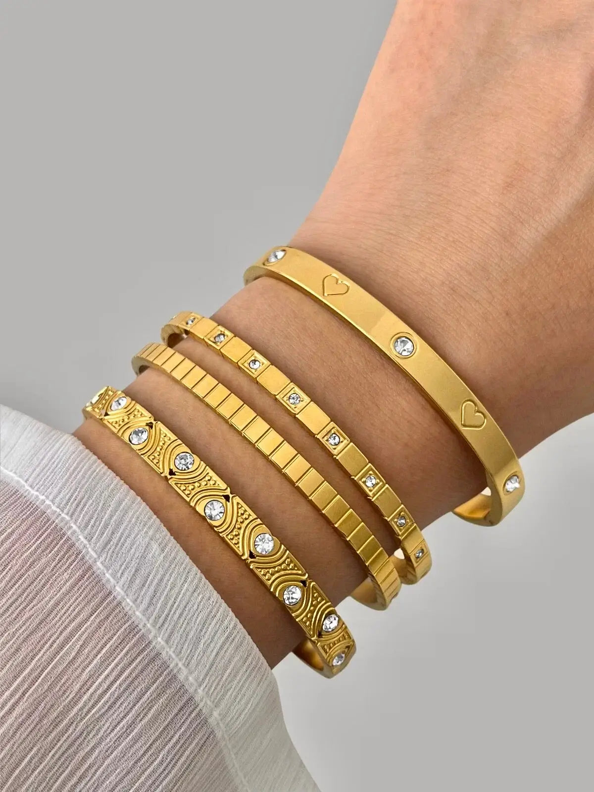 Mimi Bangle worn on wrist — 18K gold-plated stainless steel bangle by Shine With Me in Gold variant.