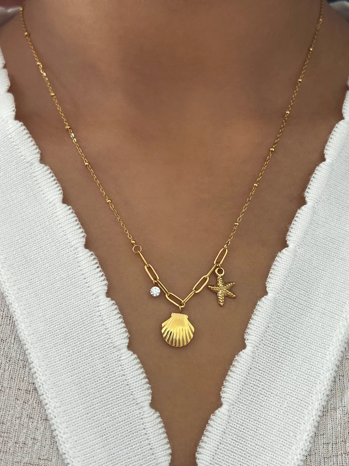 Nova Shell Necklace worn around neck — 18K gold-plated stainless steel (chain 42 cm + 5 cm) by Shine With Me, styled look.