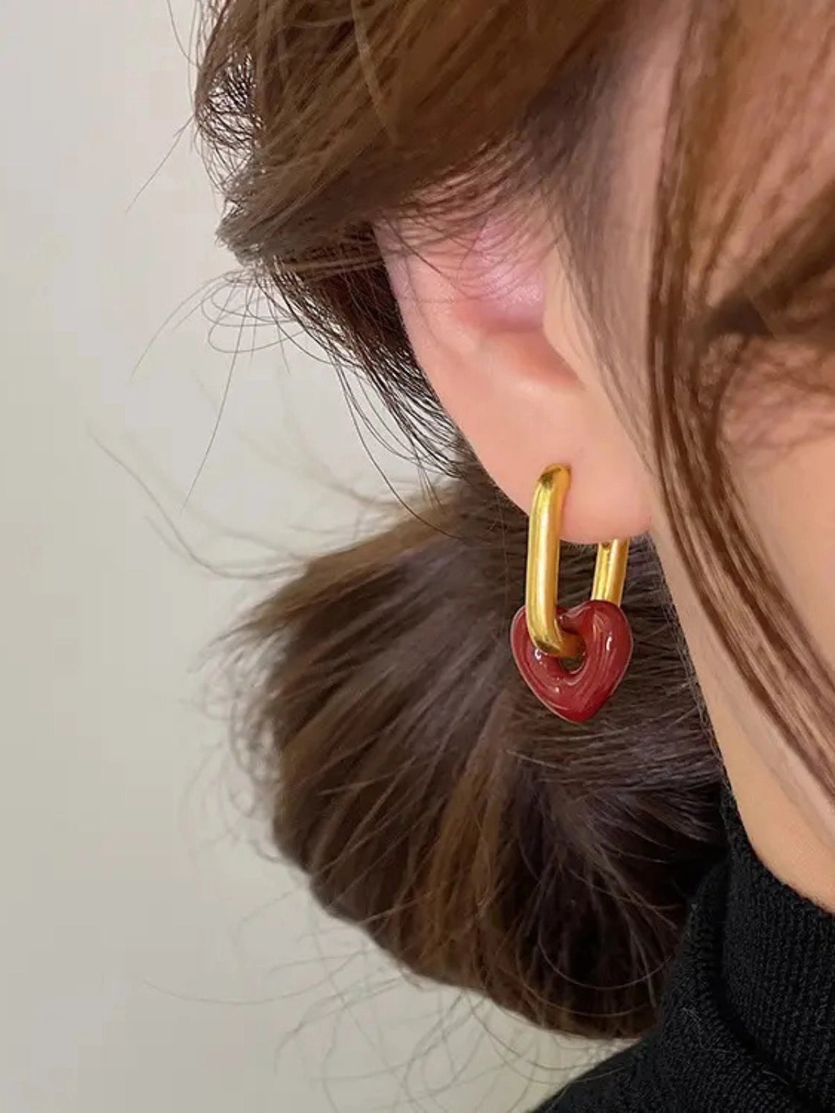 Sealed With Love Earring worn on ear — 18K gold‑plated stainless steel stud (White or Burgundy) by Shine With Me, styled look.