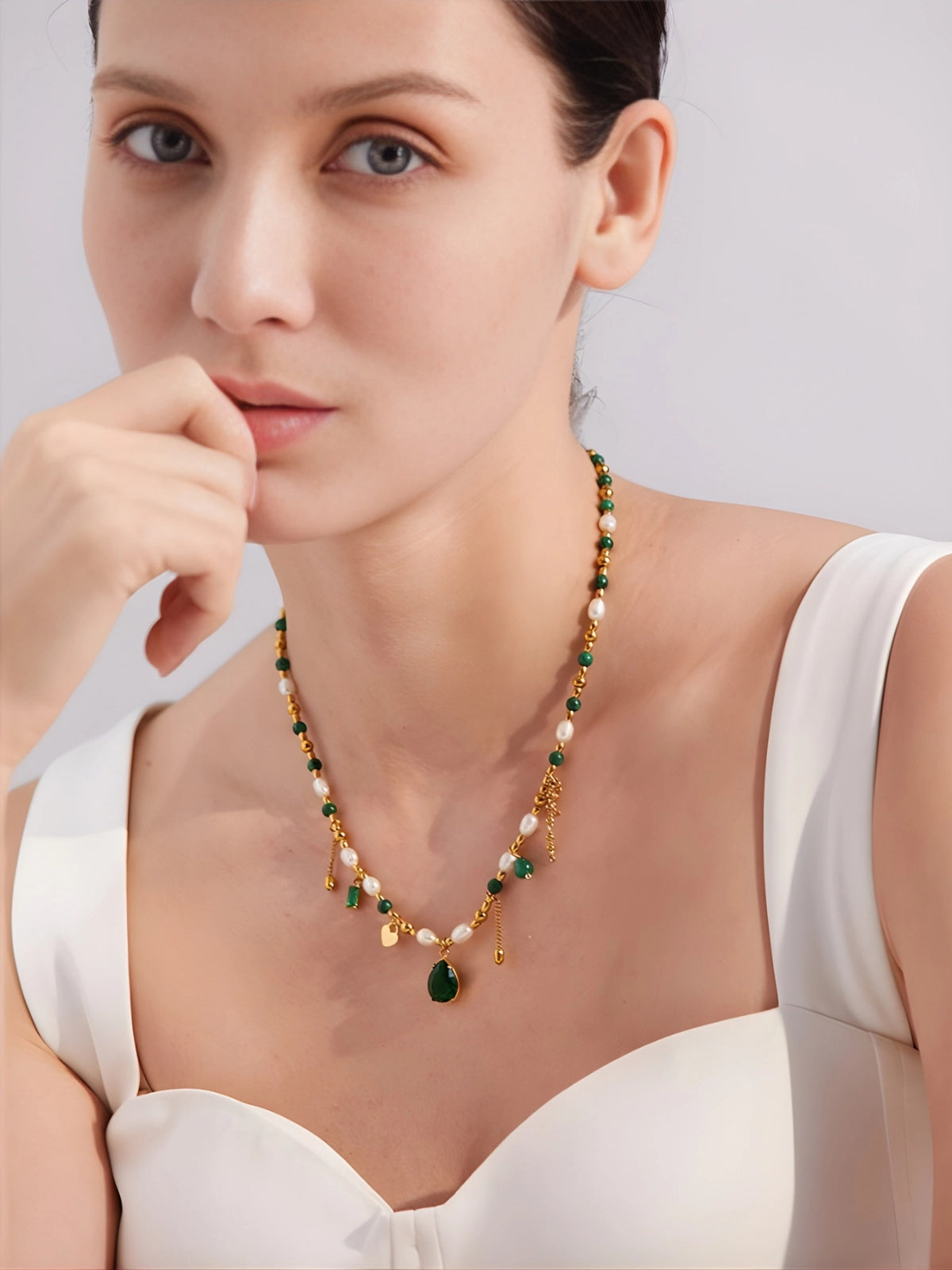 Shine With Necklace – On Model Styled Shot-Necklace with green and white beads on a white fur background