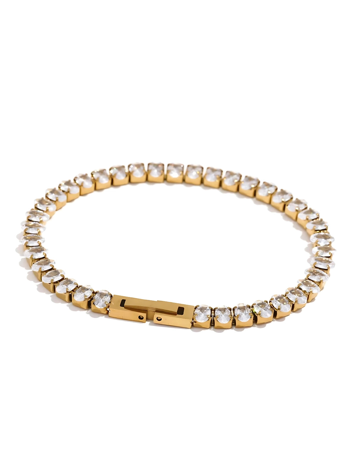 Gold bracelet with clear stones on a white background