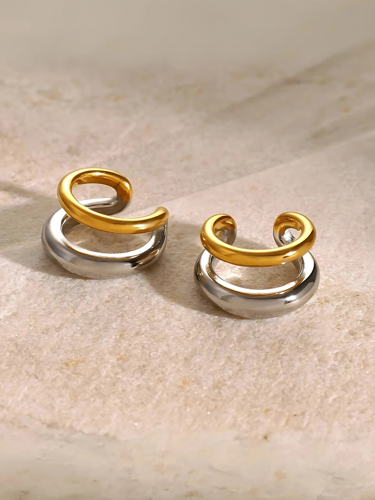 Close‑up of Whisper Ear Cuffs by Shine With Me showing the gold‑plated finish, stainless steel base and subtle design.