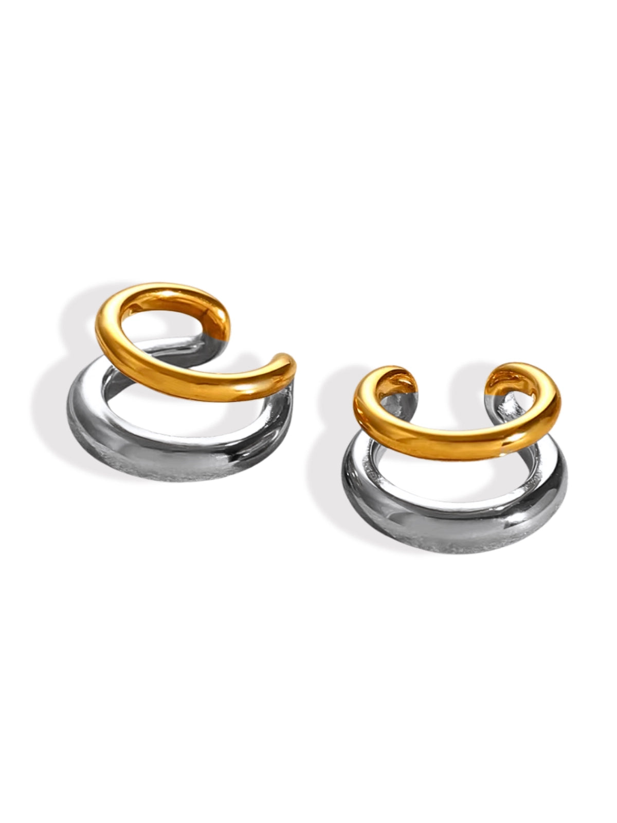 Whisper Ear Cuffs – Front View-Two ear cuffs, one with a gold finish and the other with a silver finish, displayed against a white background.
