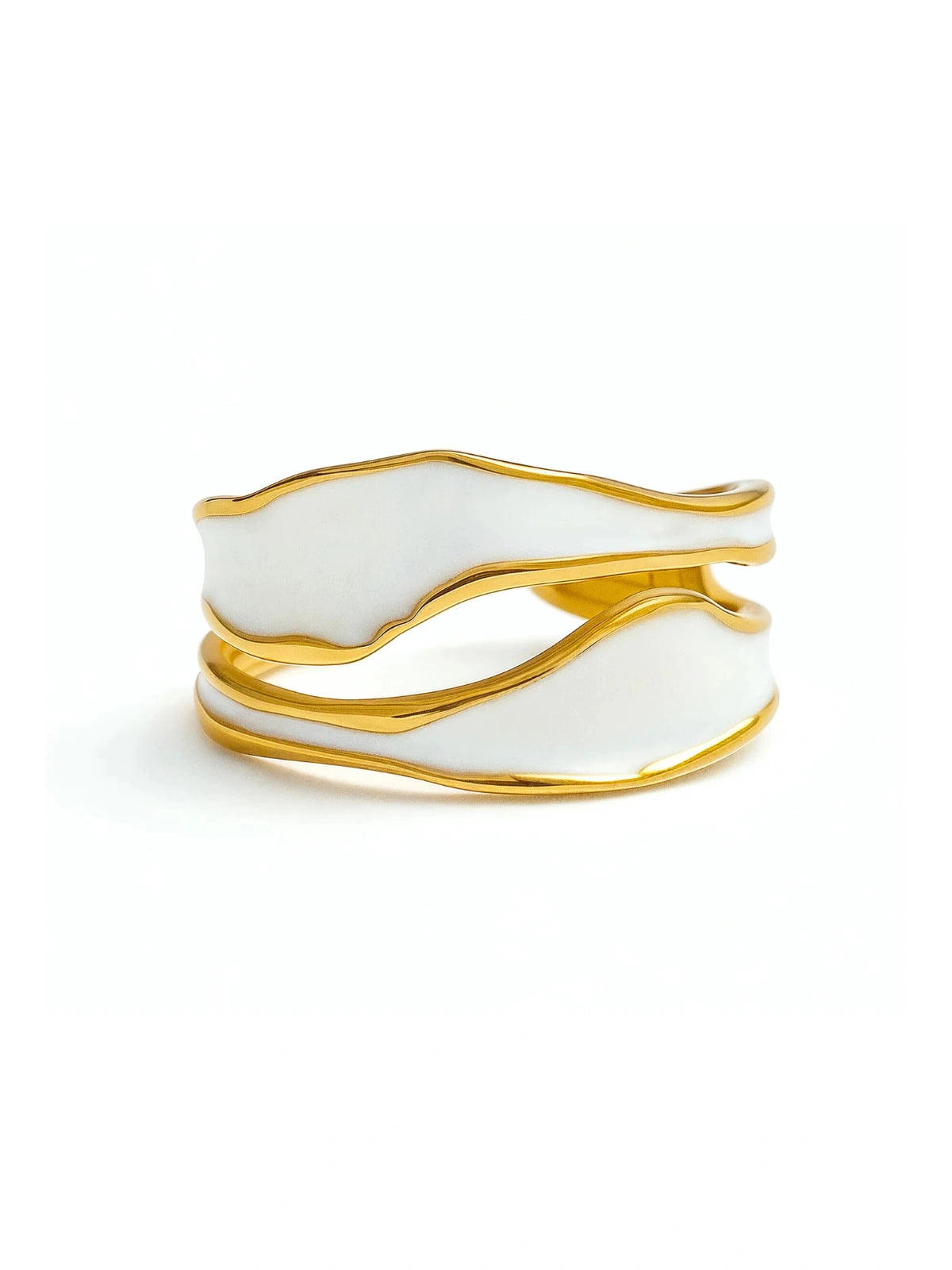 luxe-spiral-ring-front-view-shine-with-me White cuff bracelet with gold accents on a white background