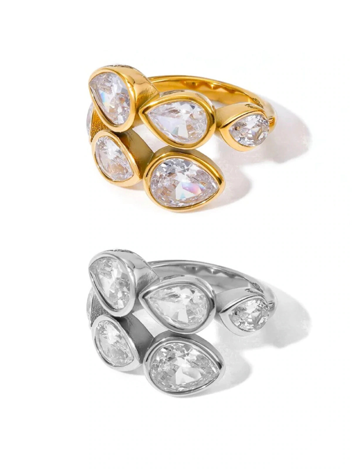 noa-ring-front-view-shine-with-me. Gold and silver rings with teardrop-shaped gemstones on a white background