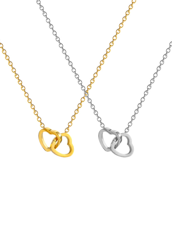 All My Love Necklace by Shine With Me displayed in Gold and Silver variants — 18K gold‑plated stainless steel, chain length 43 cm + 6 cm extender-Two necklaces with interlocking heart pendants, one gold and one silver, on a white background.