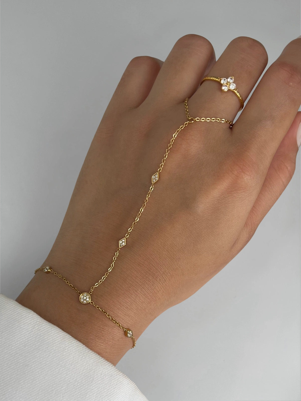 Arabella Hand Harness worn on hand — gold-plated stainless steel hand-harness by Shine With Me styled look.