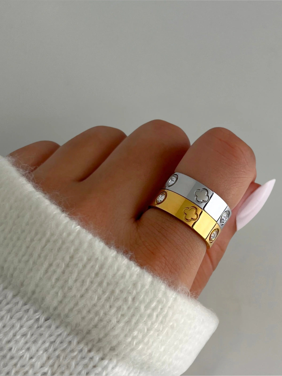 Dawn Ring – Lifestyle / Everyday Look-Close-up of a hand wearing two rings with a neutral background
