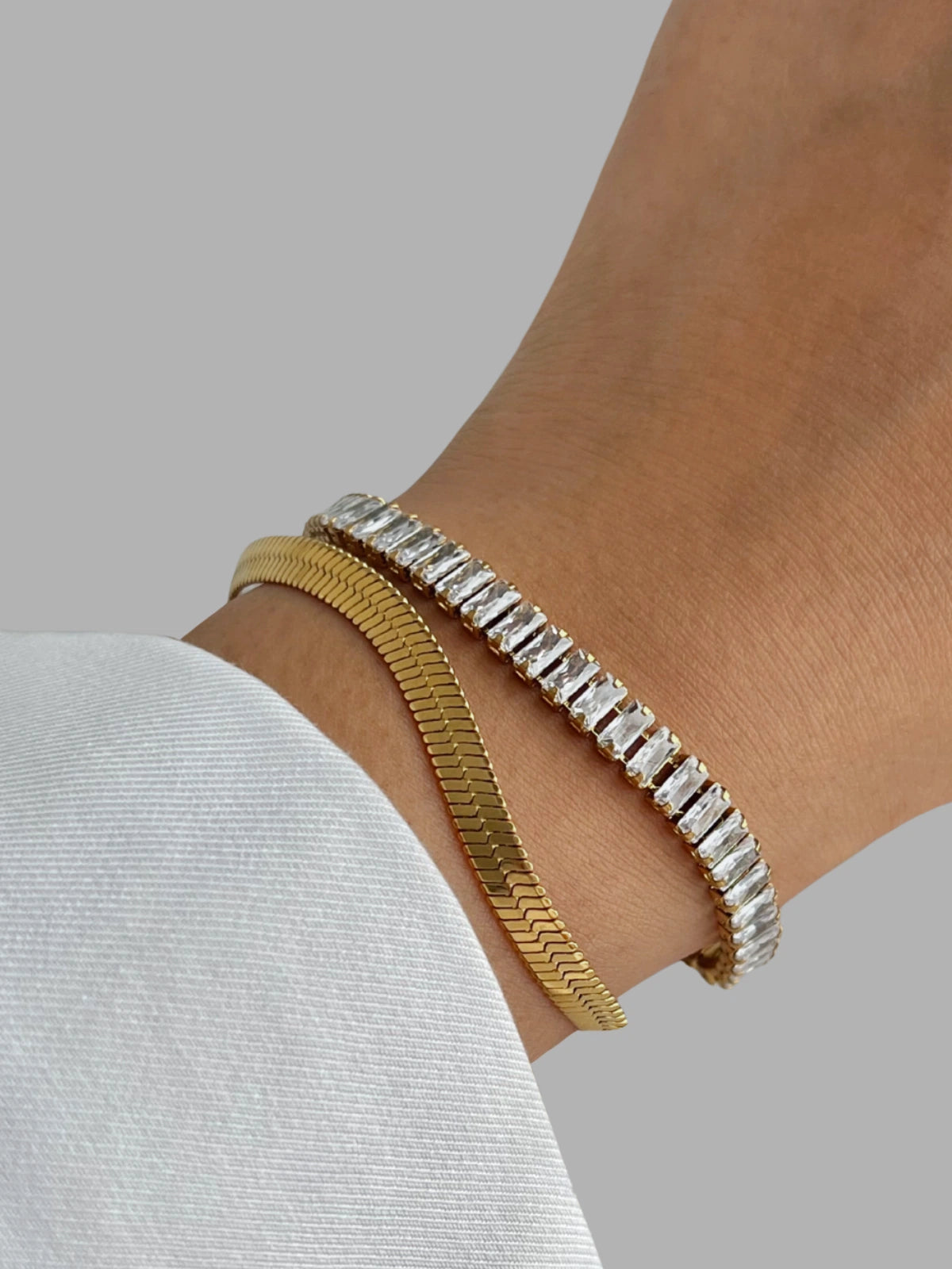 Elly Bracelet worn on wrist — 18K gold-plated stainless steel bracelet (17 cm chain, 6 mm width) by Shine With Me, styled look