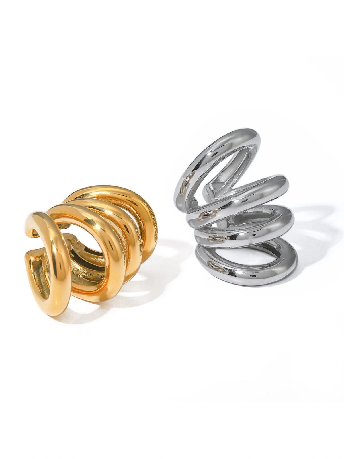 Faye Ear Cuff by Shine With Me displayed in both Gold and Silver variants — 18K gold‑plated stainless steel ear‑cuff, ready for gifting-Gold and silver spiral ring on a white background