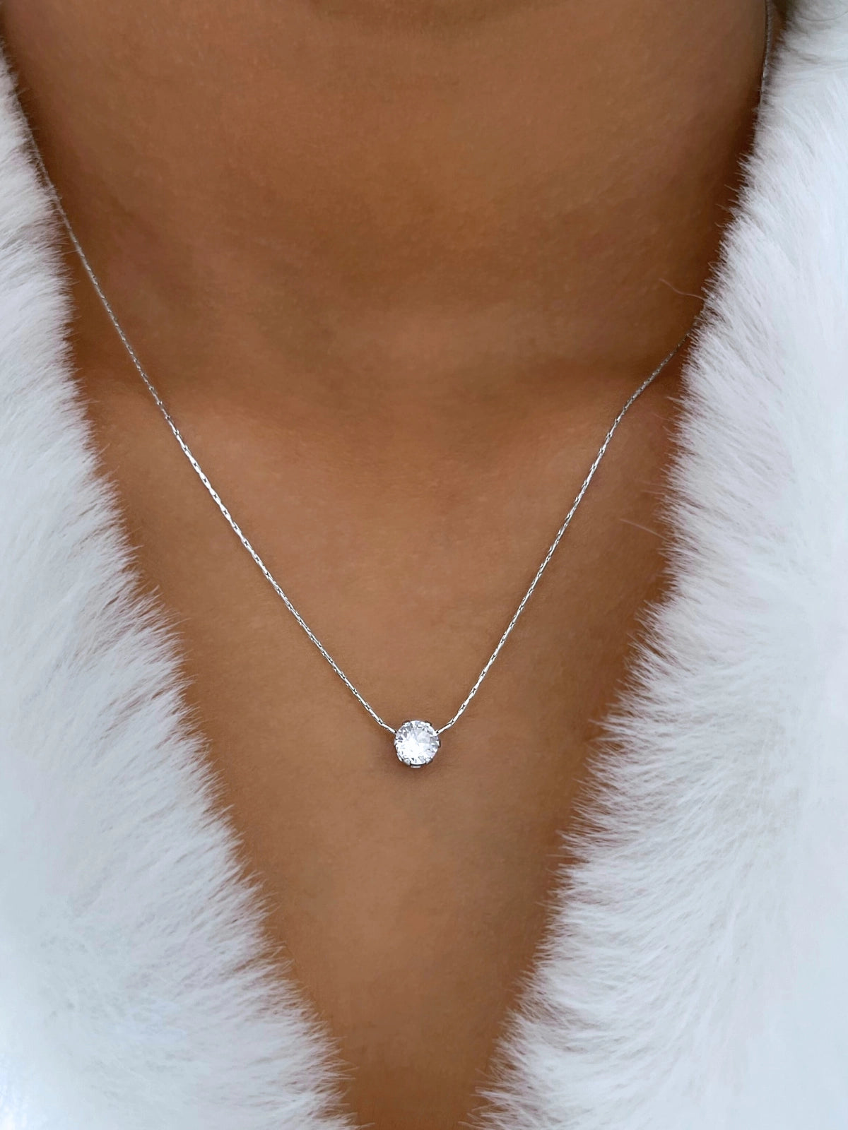 Close‑up of Glorien Necklace by Shine With Me showing the gold‑plated finish, stainless steel base and tiny 5 mm cubic zirconia pendant.