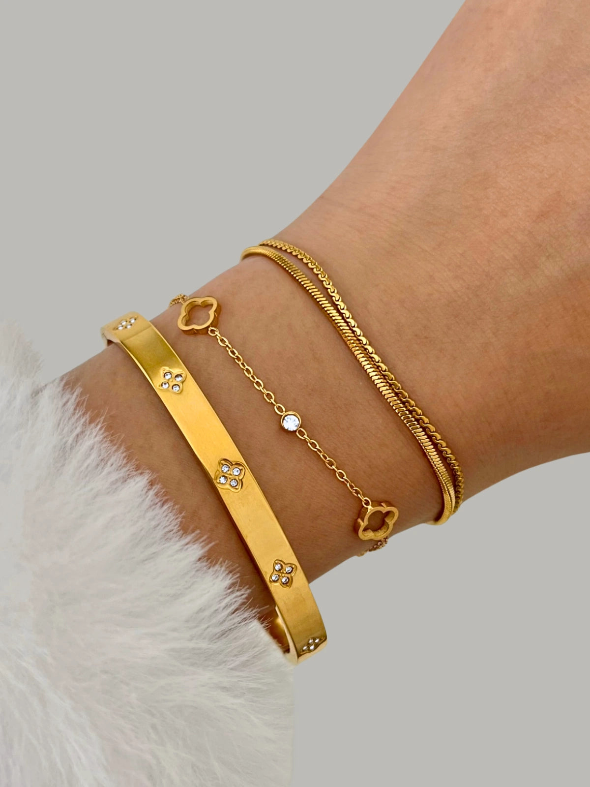 “Model wearing the Halo Clover Bracelet from Shine With Me — luxury gold-plated stainless steel bracelet with clover charm