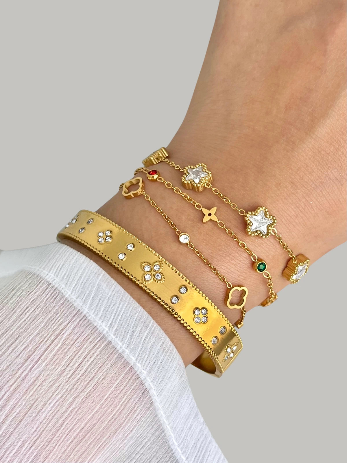 Halo Clover Bracelet styled with Shine With Me jewelry, gold-plated stainless steel piece for modern elegance.