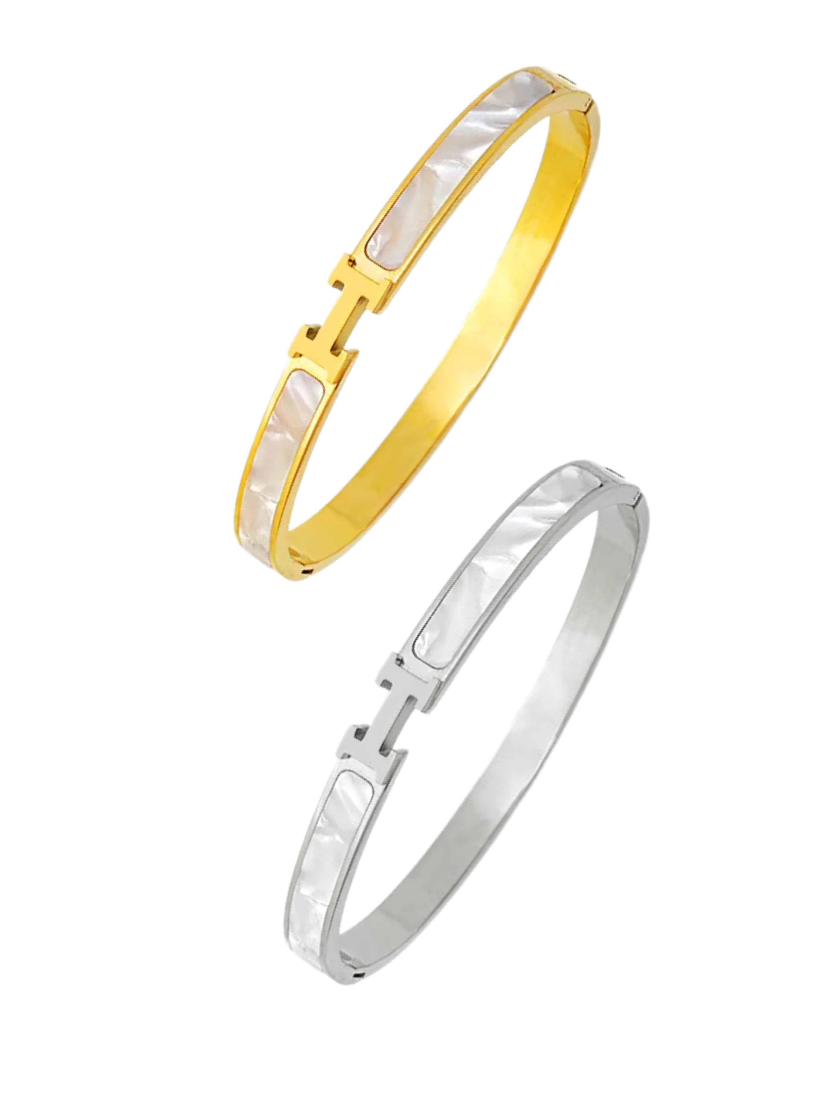 HAVEN H bangle Gold and silver bangles on a white background.