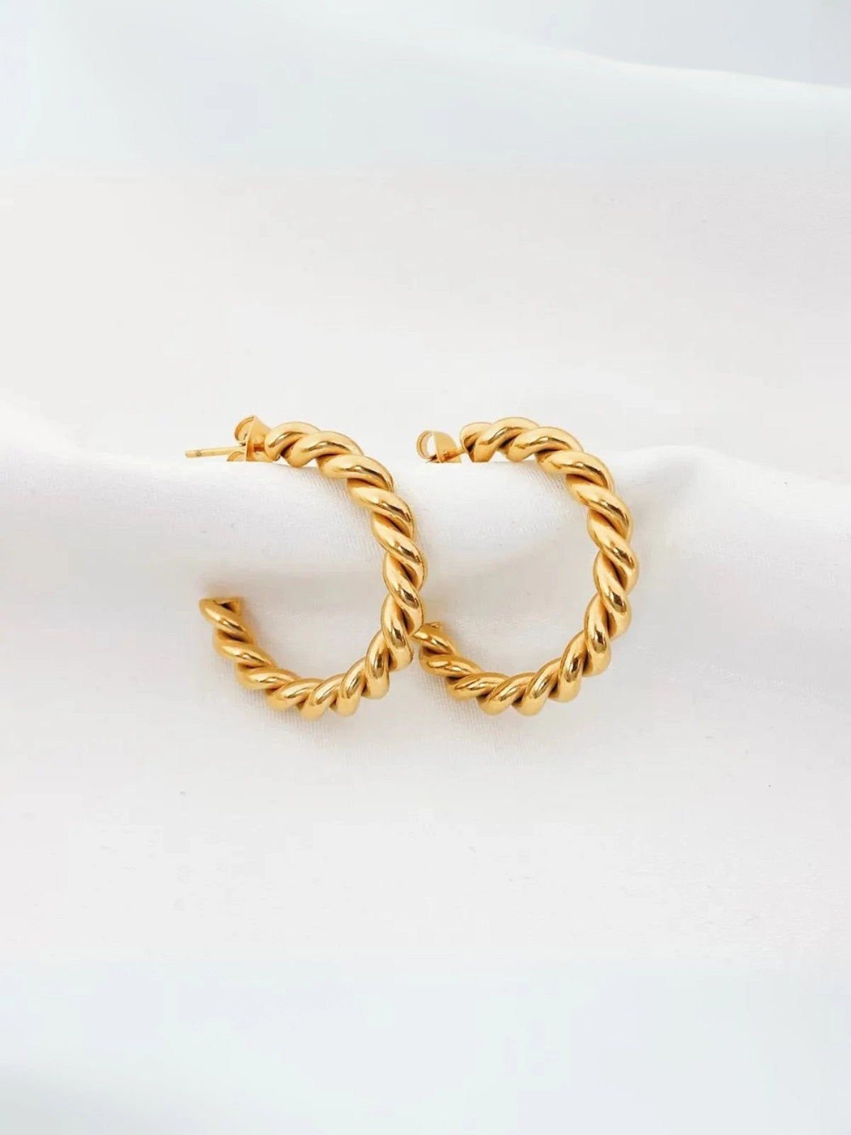 Helen Hoop Earring – Close‑Up Detail- Pair of gold hoop earrings on a white background