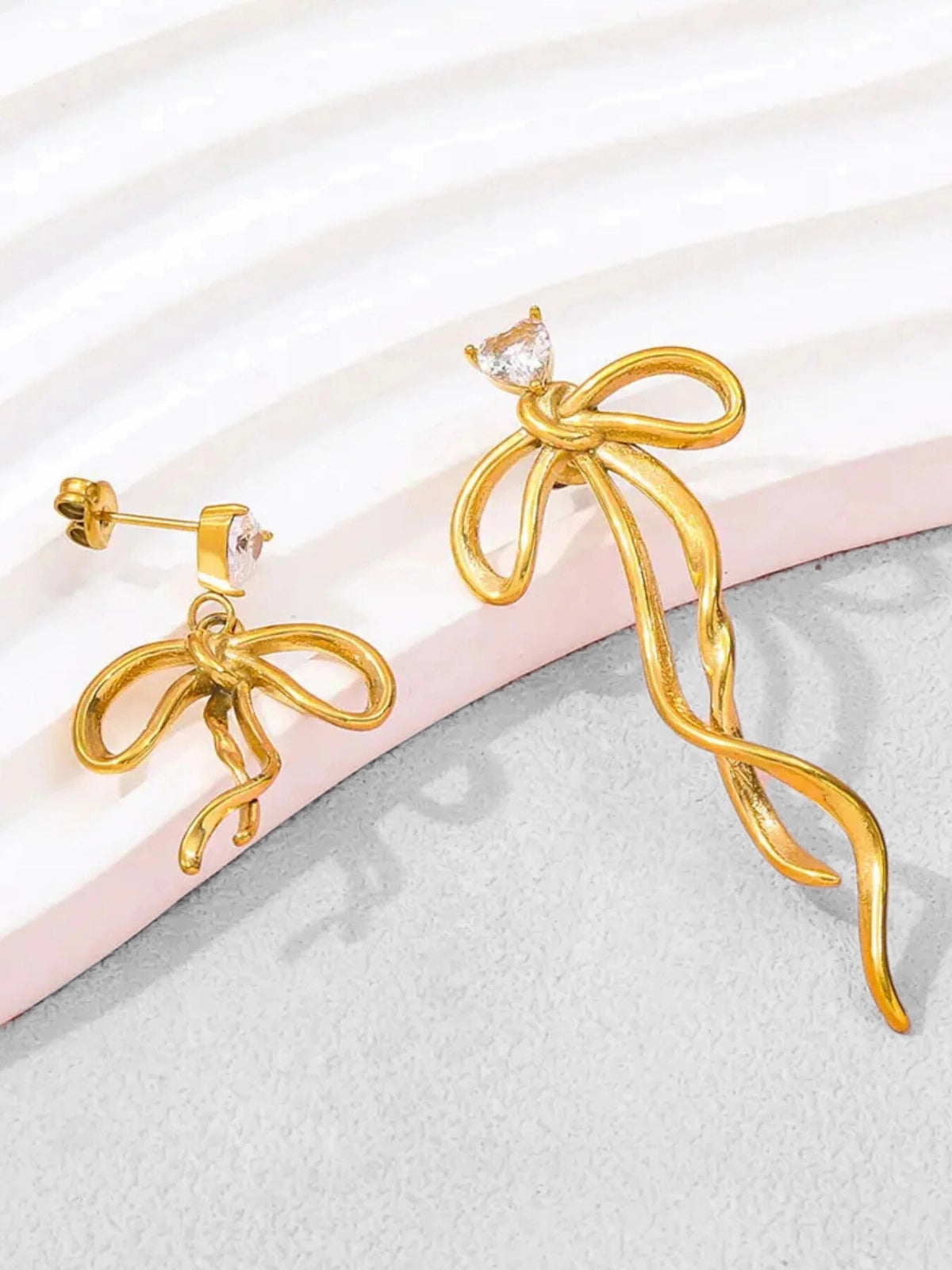 Close‑up of Lovella Bow Earring by Shine With Me showing gold‑plated finish and bow‑shape craftsmanship