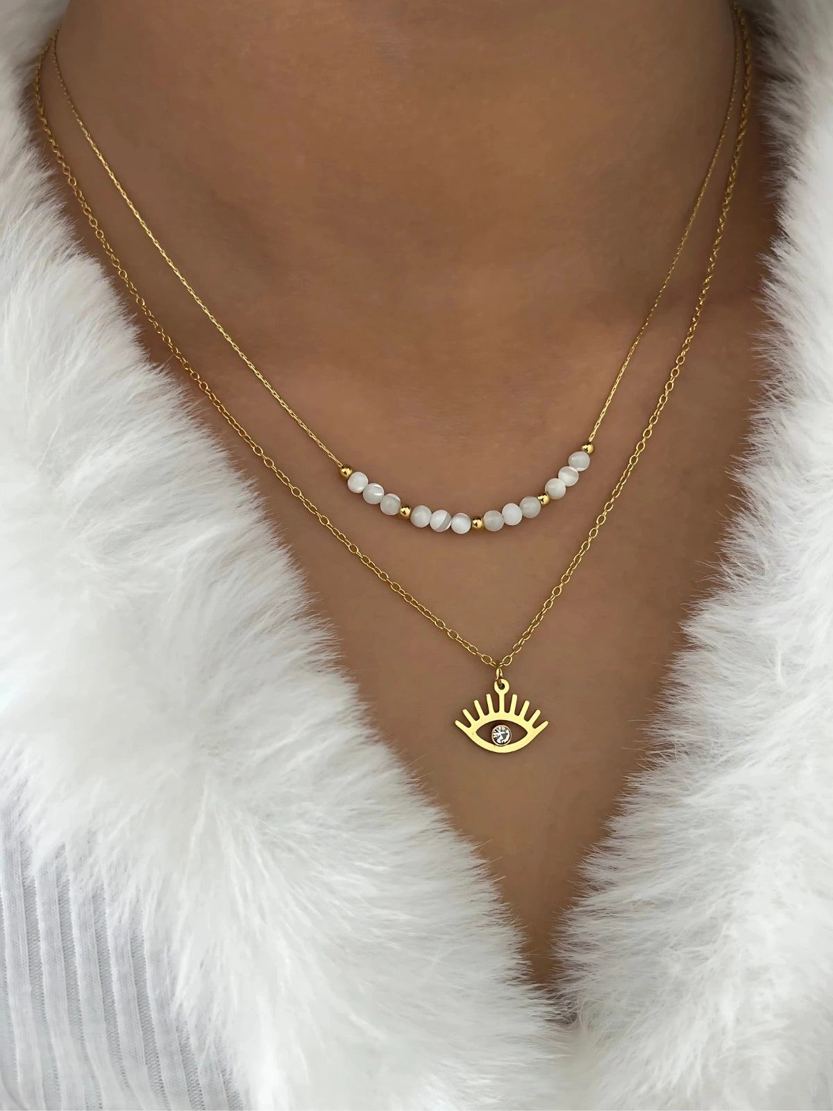 Lume Eye Necklace worn around neck — 18K gold-plated stainless steel chain (40 cm+6 cm or 43 cm+6 cm) by Shine With Me, styled look.