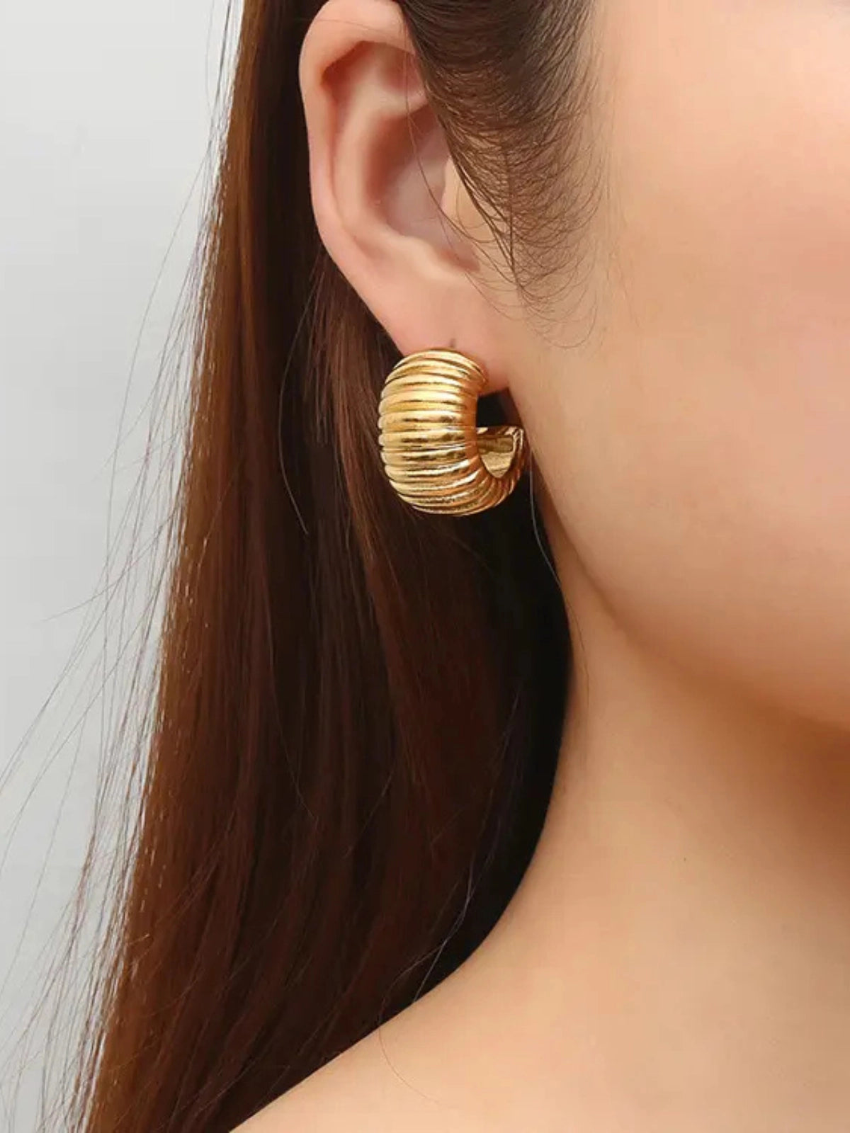 Marci Hoop Earring worn on ear — 18K gold‑plated stainless steel hoop by Shine With Me, styled look.