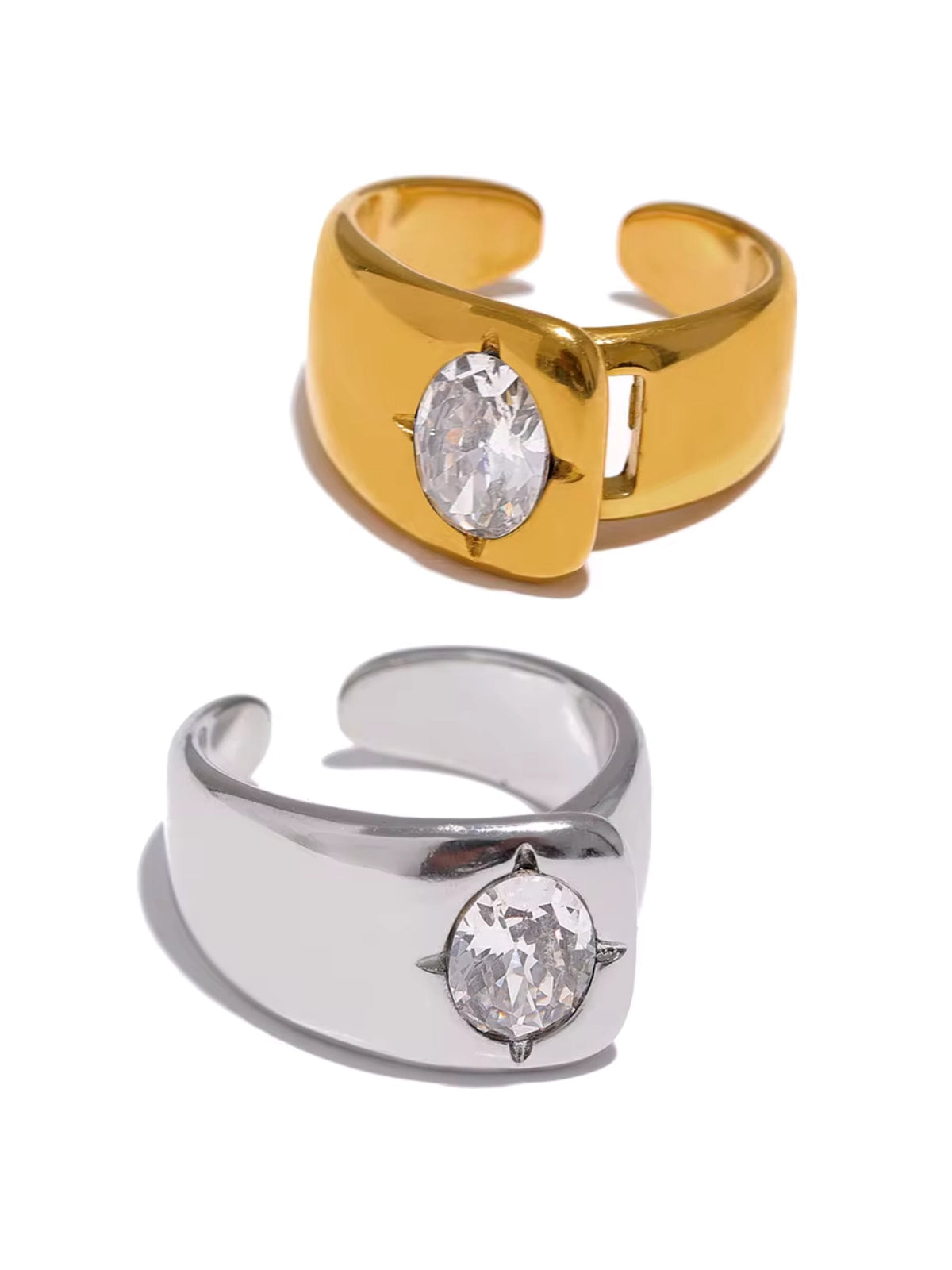 Miyara Ring Gold and silver open-topped rings with embedded stones on a white background