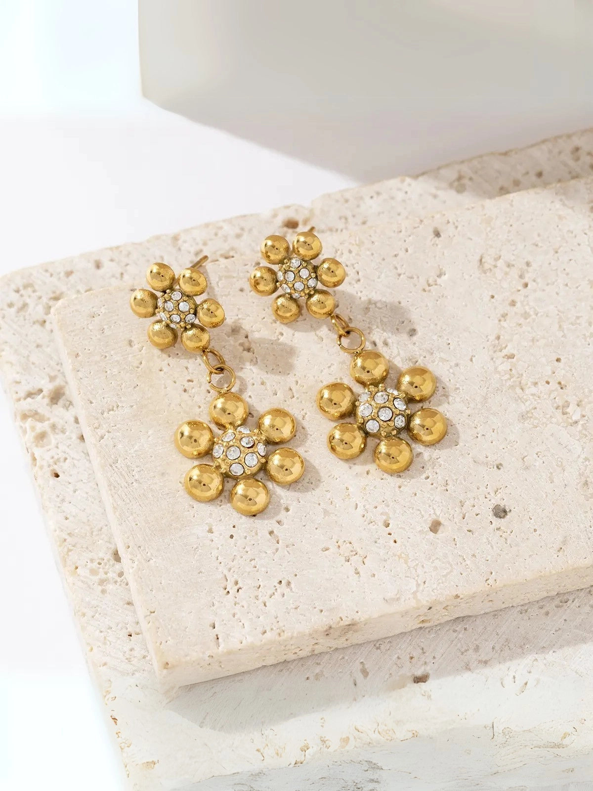 Close-up of Petalia Gold Earrings by Shine With Me showing the gold-plated finish, 33 mm size and high-quality stainless steel construction.