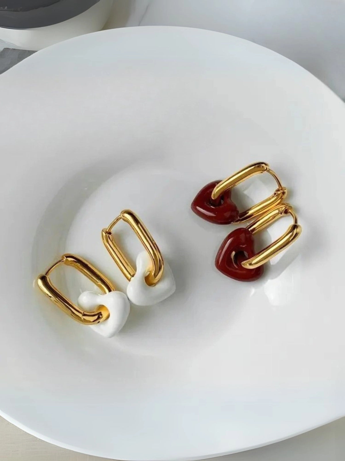 Close‑up of Sealed With Love Earring by Shine With Me showing gold‑plated finish and subtle design details.