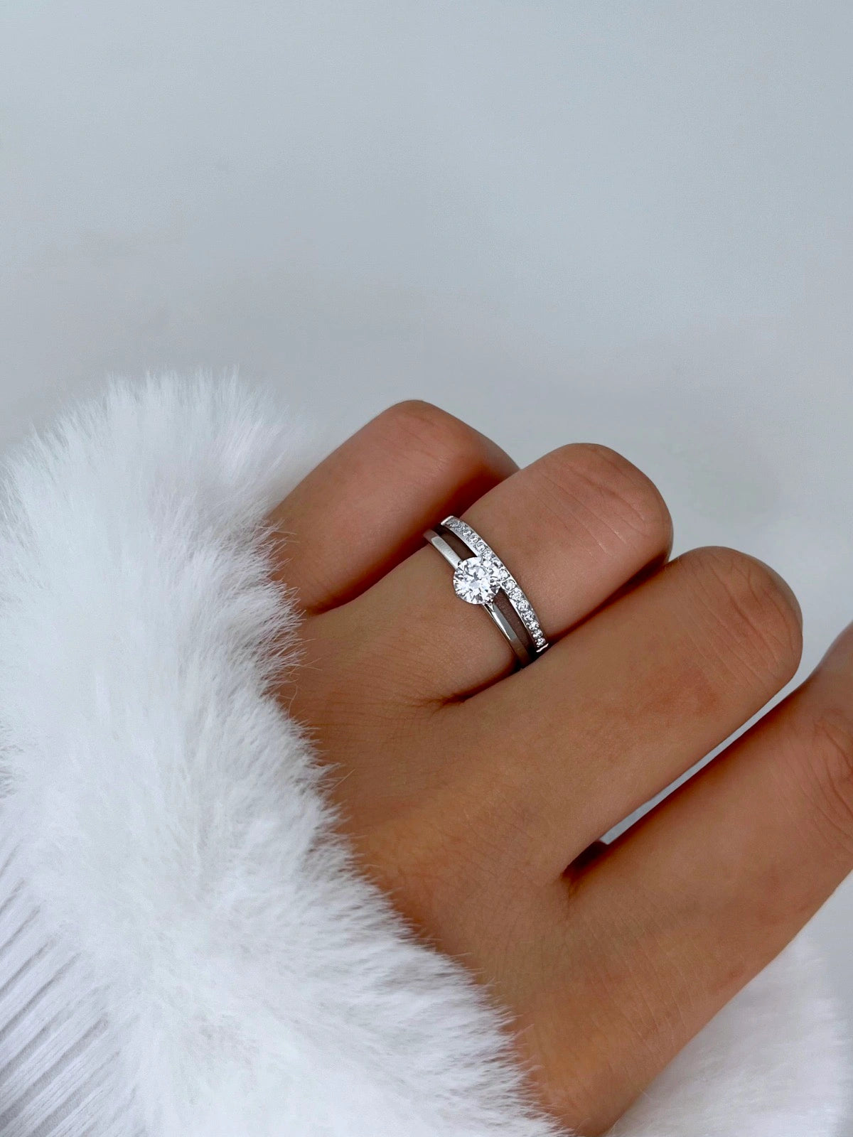 Sophisticate Ring – Worn on Finger-Silver ring on a finger against a white background
