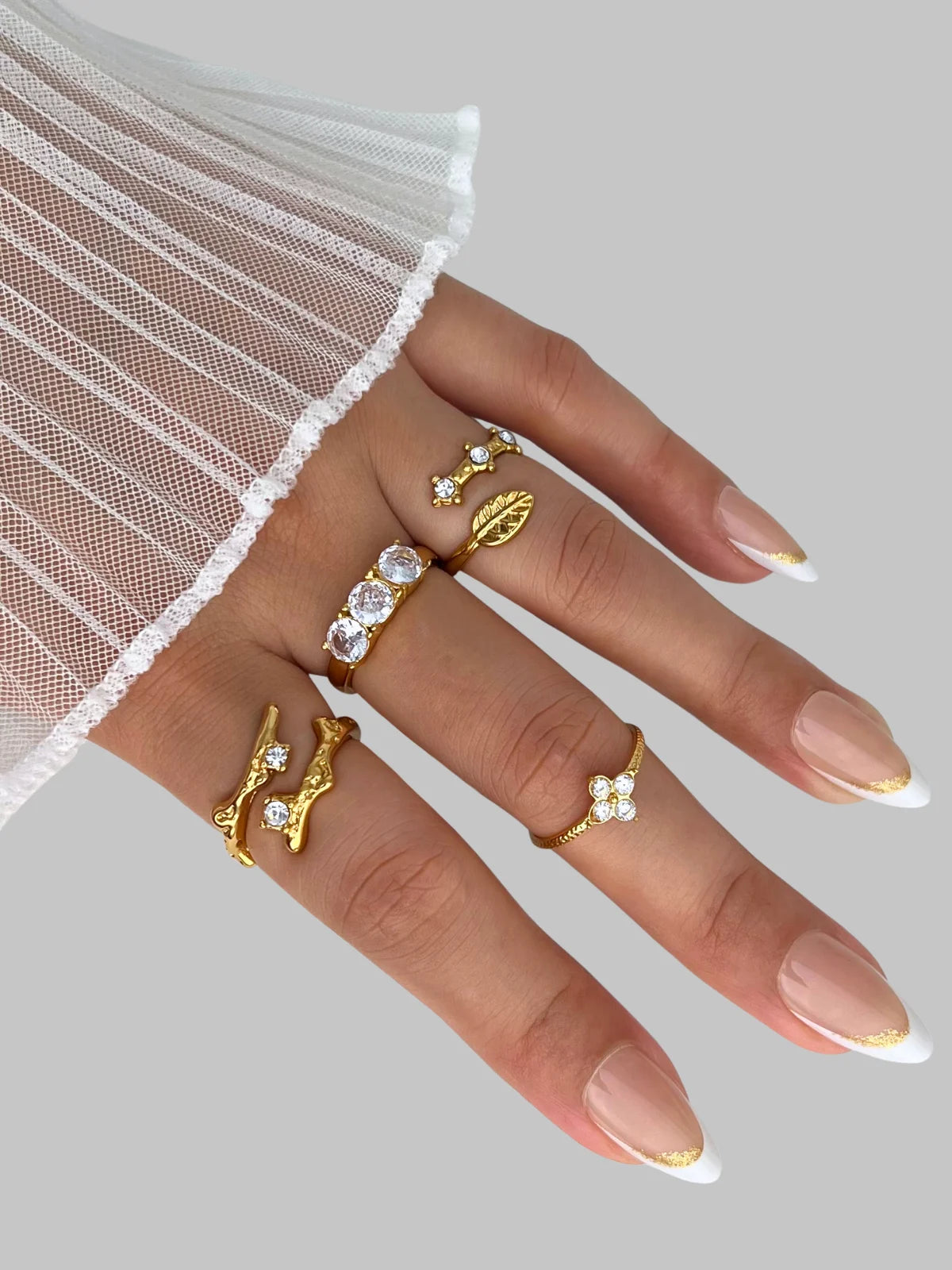 Stella Petal Ring worn on hand — 18K gold-plated stainless steel & cubic zirconia by Shine With Me, styled look.