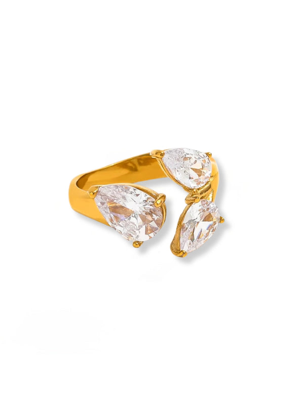 The Astria Ring – Front View-Gold ring with three clear pear-shaped gemstones on a white background