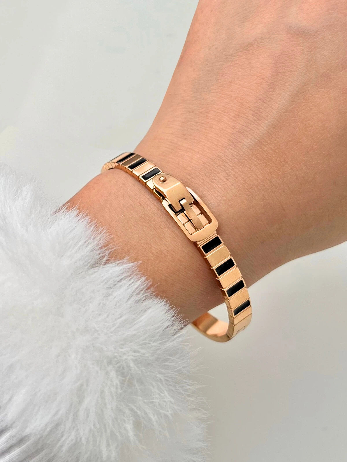 Timeless Ties Bracelet worn on wrist — 18K gold-plated stainless steel bracelet (width 65 mm) by Shine With Me, styled look.
