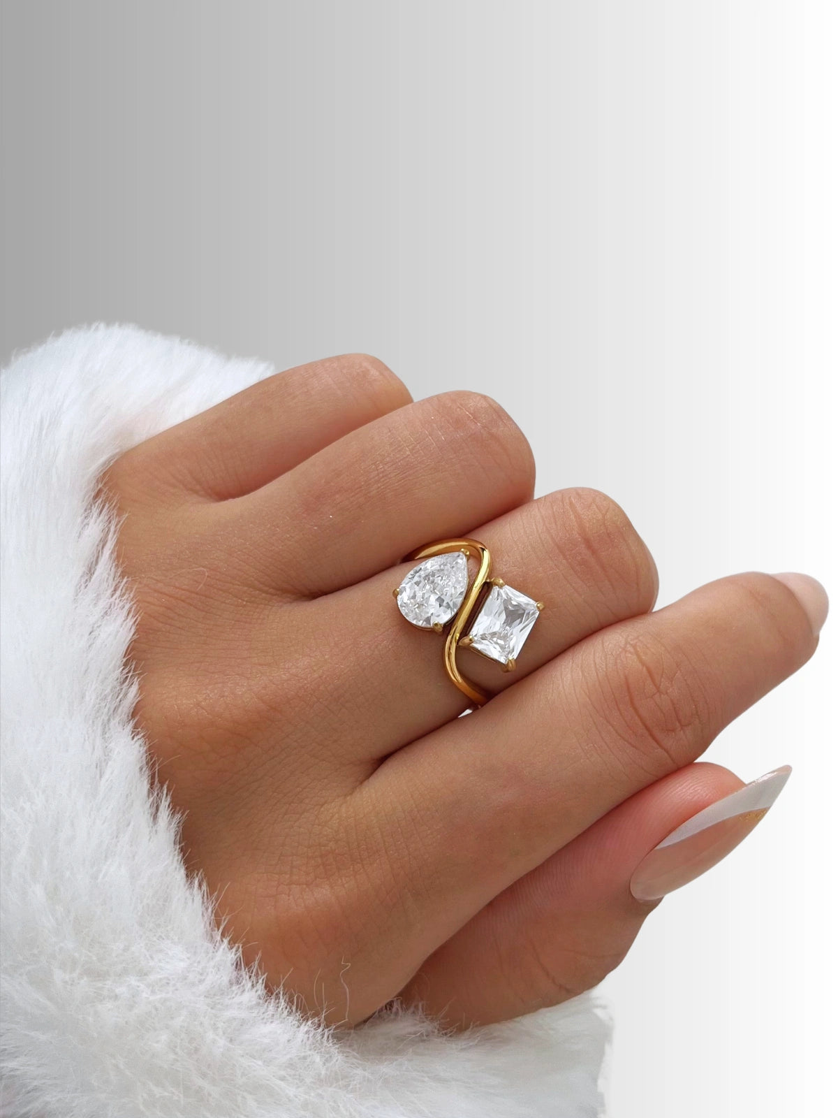 Water Drop Ring – Worn on Finger-Gold ring with a large diamond on a white background