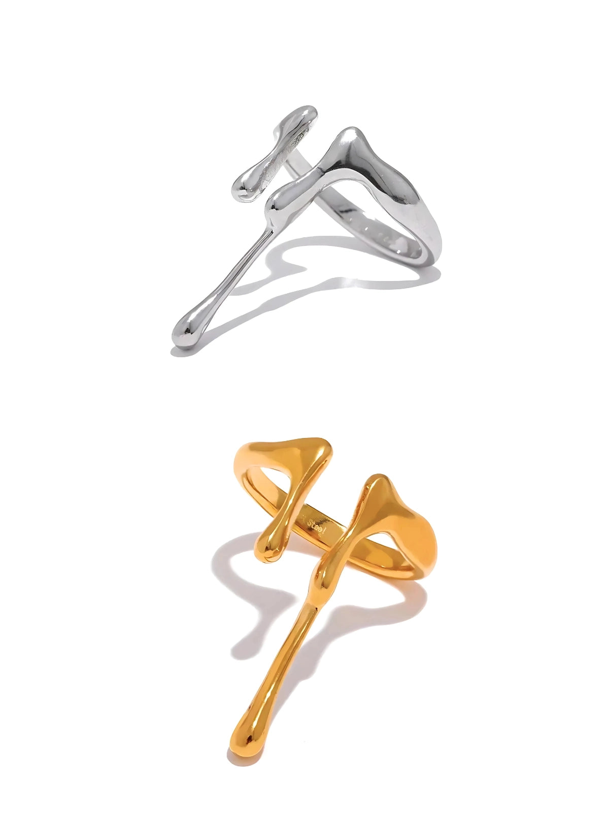 aqua-ring-front-view-shine-with-me Two rings, one in gold color and the other in silver color, with a design that resembles a water droplet or teardrop.