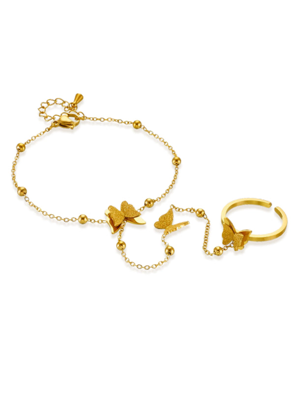 butterfly-hand-lace-front-view-shine-with-me-Gold bracelet and ring set with butterfly designs on a white background