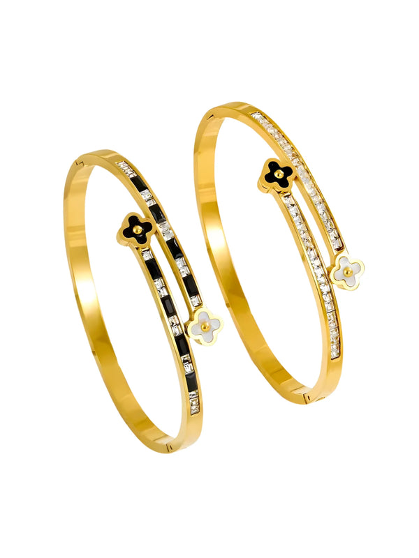 Shine With Me Elowen Clover Bangle 18K gold plated with clover design. Two gold bangles with black and white accents on a white background