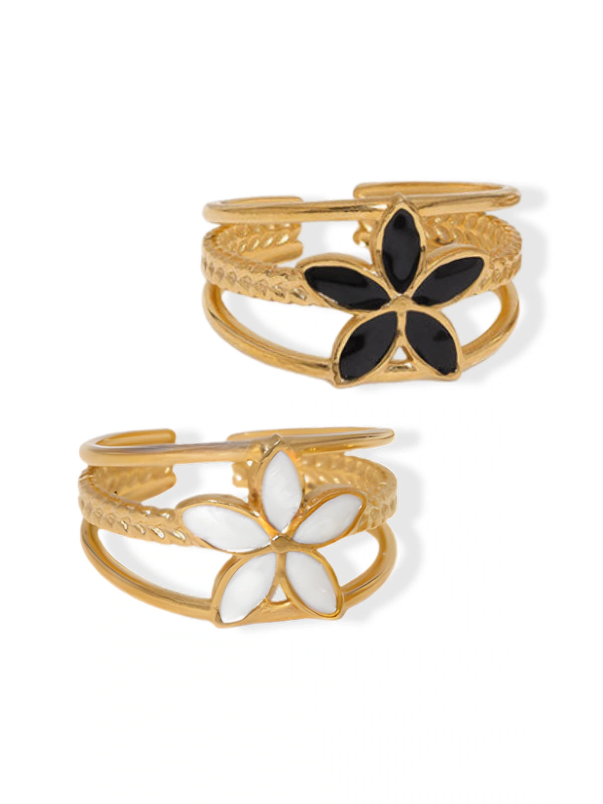 serena-flower-ring-front-view-shine-with-me Two gold floral cuff bracelets with black and white flowers on a white background
