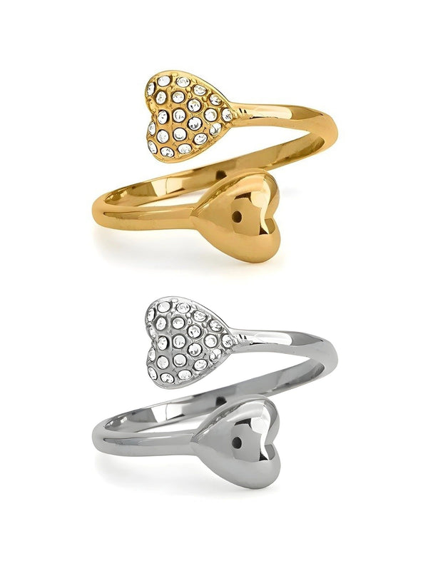 us-together-ring-front-view-shine-with-me Two heart-shaped rings, one gold and one silver, on a white background